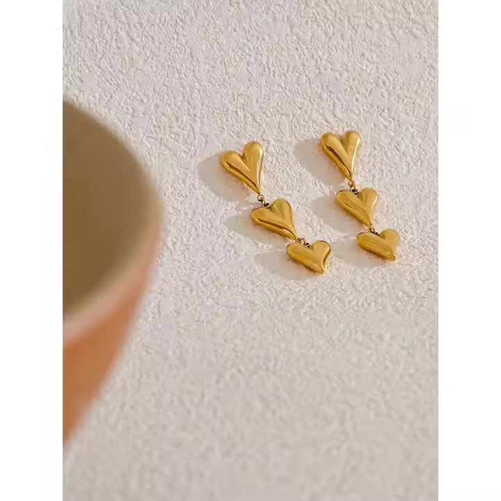 Step heart earrings